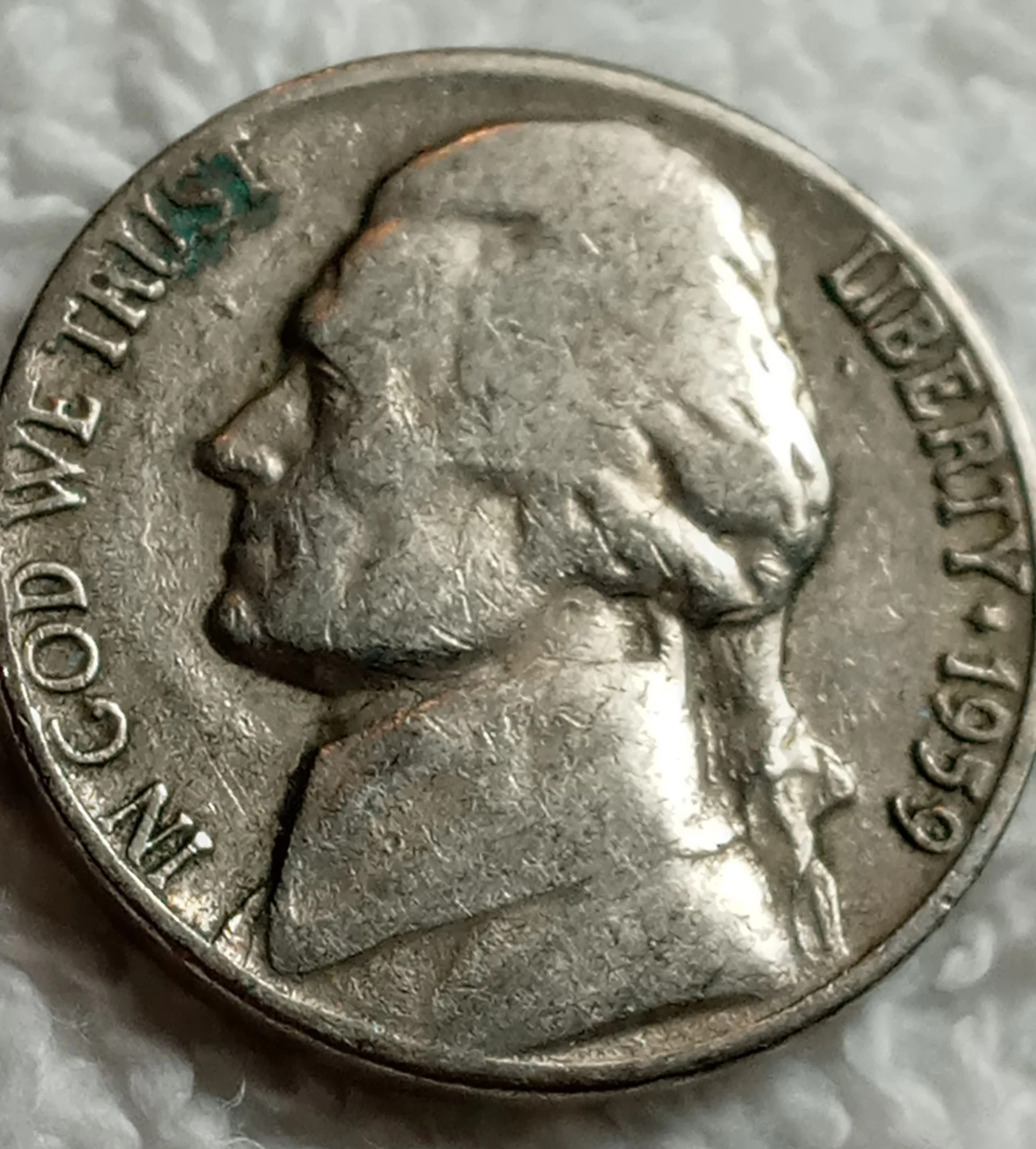 1959 Jefferson Nickel doubled die error showing doubling on E PLURIBUS UNUM reverse lettering under magnification