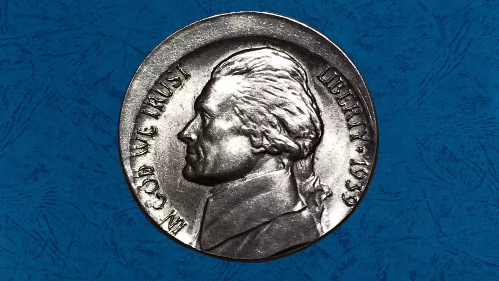 1959 Jefferson Nickel off-center strike error showing design shifted significantly with visible crescent of blank planchet